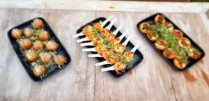 Three platters of canapés including prawn, tart and bruschetta bites